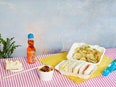 Food on striped tablecloth.