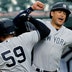 New York Yankees' Luke Voit celebrates with Giancarlo Stanton.