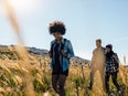 Group of people hiking in countryside.