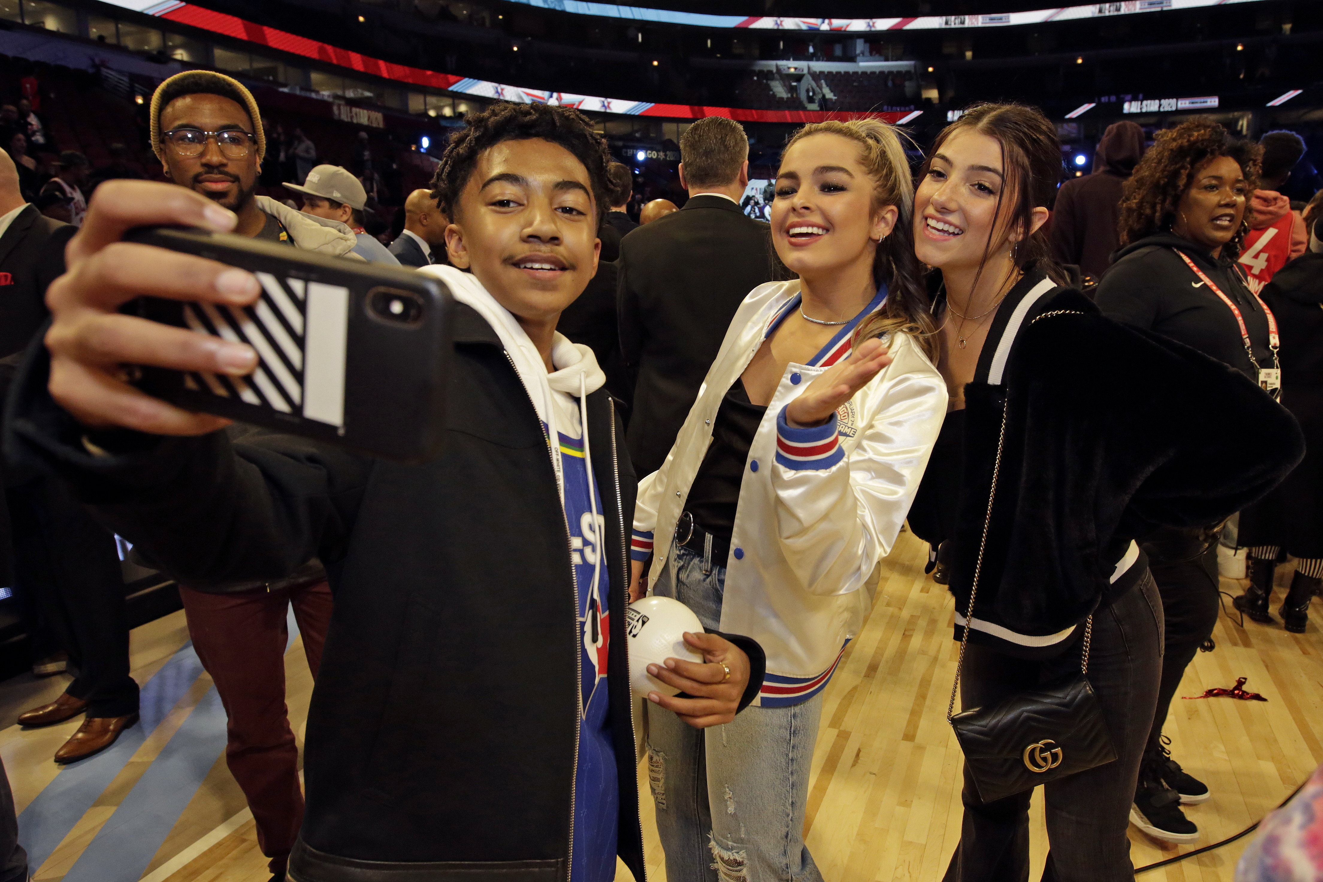 Actor Miles Brown takes a selfie with TikTok stars Addison Rae Easterling and Charlie D’Amelio during the 69th NBA All-Star Game.