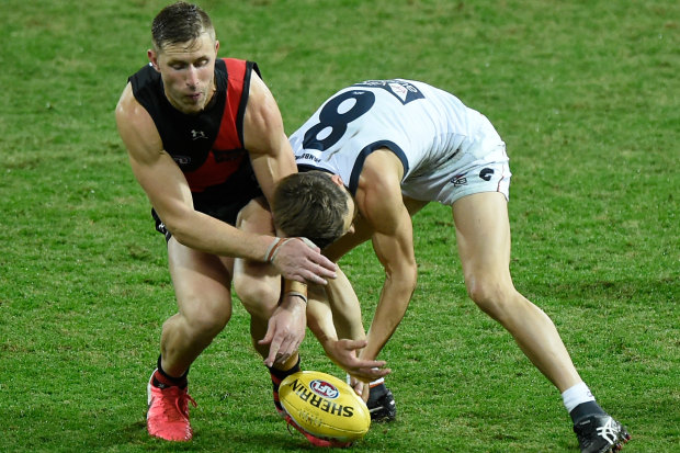 Callan Ward was accused of staging after being awarded a free kick for this incident with Essendon's Shaun McKernan.