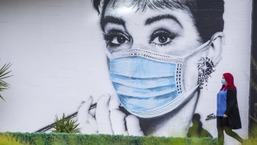 Street art in Moorabin depicting the iconic photo of Audrey Hepburn in Breakfast At Tiffany's wearing a mask. 