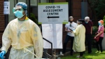 People line up to be tested at a COVID-19 assessment centre in Toronto on Tuesday, May 26, 2020. Health officials and the government have asked that people stay inside to help curb the spread of COVID-19. THE CANADIAN PRESS/Nathan Denette
