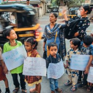 Children join with residents of Mahul to form a human chain as part of an International Human Rights Day protest against the government. Pratik Chorge/Hindustan Times via Getty Images