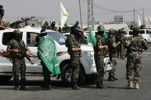 A Militants of Ezzedine al-Qassam Brigades, the military wing of the Palestinian Islamic movement Hamas, on patrol at Rafah border between Gaza strip and Egypt in the southern Gaza strip on October 18, 2012. Last year, Israel freed more than 1,000 jailed Palestinians in a swap for Gilad Shalit, an Israeli soldier held in Gaza.Photo by Ahmed Deeb / WN