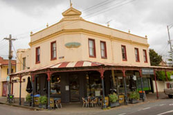 Heritage building on a street corner housing a cafe