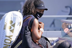 Naomi Osaka, of Japan, leaves the court after winning her match with Anett Kontaveit, of Estonia, during the quarterfinals at the Western & Southern Open tennis tournament Wednesday, Aug. 26, 2020, in New York