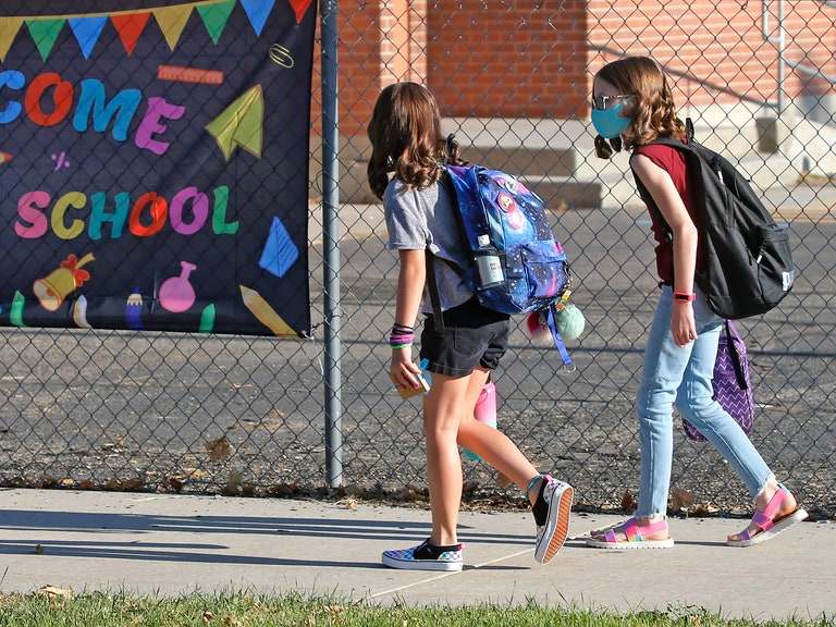 Two 6th graders arrive at school.