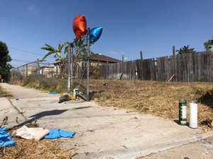 Balloons, candles and flowers are left as a memorial for Dijon Kizzee where he was fatally shot by Los Angeles sheriff