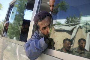 Afghan Taliban prisoners ride in a bus as they are freed from Bagram Prison in Parwan province, Afghanistan, Tuesday, May 26, 2020.