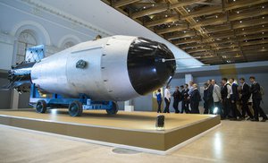 People look at a replica of a Soviet AN-602, or Tsar Bomb, the most powerful nuclear bomb ever detonated, which is now on display at Manezh in Moscow, Russia, Tuesday, Sept. 1, 2015.