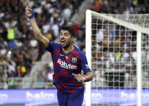 Barcelona's Luis Suarez reacts during the Spanish Super Cup semifinal soccer match between Barcelona and Atletico Madrid at King Abdullah stadium in Jiddah, Saudi Arabia, Thursday, Jan. 9, 2020.