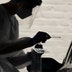 A medical professional administers a coronavirus test at a drive-thru.