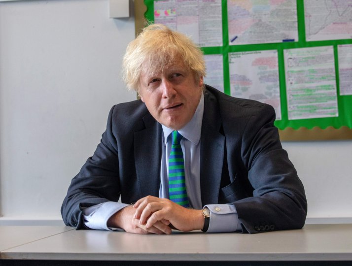 Boris Johnson joins a class of year 11 pupils at Castle Rock school, Coalville, central England on August 26, 2020,