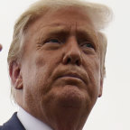 US President Donald Trump walks away from the media to board Air Force One for a trip to a campaign rally in Michigan.