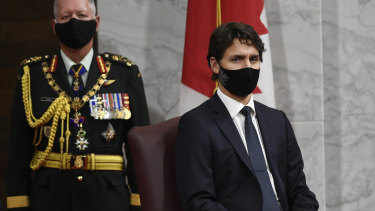 Canadian Chief of Defence Staff Jonathan Vance, left, and Prime Minister Justin Trudeau listen to Governor General Julie Payette deliver the throne speech in the Senate chamber in Ottawa.