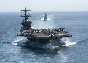 200918-N-NH257-1037 STRAIT OF HORMUZ (Sept. 18, 2020) The aircraft carrier USS Nimitz (CVN 68) and the guided-missile cruiser USS Philippine Sea (CG 58) steam in formation during a Strait of Hormuz transit, Sept. 18.