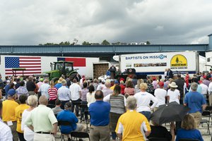 Donald J. Trump listens as Secretary of Agriculture Sonny Perdue delivers remarks in support of the Farmers to Families Food Box distribution program