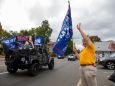 Trump supporter Karen Matthews waves a flag at