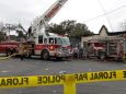 Firefighters at the scene Sunday of a fire