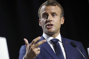 French President Emmanuel Macron participates in a joint press conference with President Donald Trump at the G-7 summit in Biarritz, France, Monday, Aug. 26, 2019.