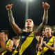 Dustin Martin and his Tigers team mates celebrate winning in round 17. 