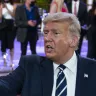 President Donald Trump talks with voters after his town hall in Miami.