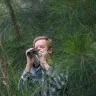 Michael Livingston searches for birds in Royal Park during lockdown. 