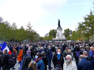 People rally in homage to Samuel Paty, a teacher who was killed and beheaded because he had shown his students a Charlie Hebdo cartoon depicting the Islamic prophet Muhammad during a class on freedom of expression, Place de la République, Paris, France, 18th October, 2020.