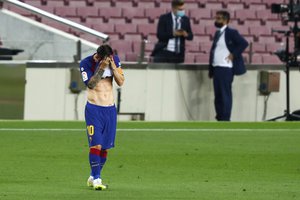 Lionel Messi reacts during a Spanish La Liga soccer match between Barcelona and Osasuna