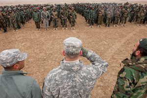 File - Lt. Gen. William B. Caldwell, IV, Commander, NATO Training Mission – Afghanistan, front, center, meets Afghanistan National Army solders during his visit of Kabul Military Training Center, Black Horse Forward Operating Base. These troops will play an integral role in the increased capability of the ANA.