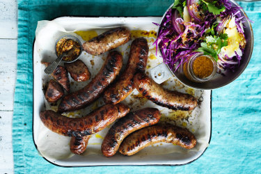 Barbecued sausages with red cabbage and mustard salad.