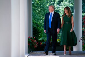 President Donald J. Trump and First Lady Melania Trump walk along the West Wing Colonnade Thursday, May 2, 2019, prior to attending the National Day of Prayer service in the Rose Garden of the White House, 2 May 2019