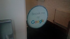 A sign requesting the reader to visit this company on Google's website in the Groninger city of Winschoten, Oldambt.