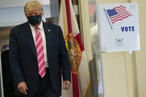 Donald Trump walks to speak with reporters after voting at the Palm Beach County Main Library, Saturday, Oct. 24, 2020, in West Palm Beach, Fla.