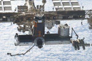 A close-up view of the International Space Station is featured in this image photographed by an STS-133 crew member on space shuttle Discovery after the station and shuttle began their post-undocking relative separation.