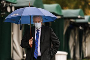 White House chief of staff Mark Meadows walks to the West Wing on the North Lawn of the White House, Sunday, Oct. 25, 2020