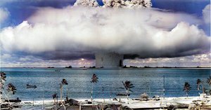 File, Colorized - The "Baker" explosion, part of Operation Crossroads, a nuclear weapon test by the United States military at Bikini Atoll, Micronesia, on 25 July 1946. The wider, exterior cloud is actually just a condensation cloud caused by the Wilson chamber effect, and was very brief.