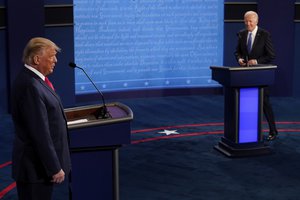 Donald Trump and Joe Biden walk on stage during the second and final presidential debate