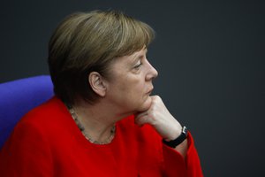 German Chancellor Angela Merkel follows the debate at the German parliament Bundesyag after her speech ahead of a EU summit and Germany's EU presidency in Berlin, Germany, Thursday, June 18, 2020.