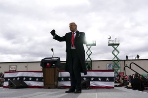 President Donald Trump dances after speaking at a campaign rally at Oakland County International Airport, Friday, Oct. 30, 2020, at Waterford Township, Mich.