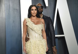 File - Kim Kardashian, left, and Kanye West arrive at the Vanity Fair Oscar Party on Sunday, Feb. 9, 2020, in Beverly Hills, Calif.