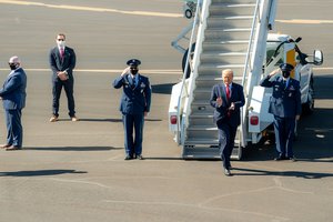 President Donald J. Trump disembarks Air Force One at Laughlin/Bullhead International Airport in Bullhead, Ariz. Wednesday, Oct. 28, 2020, and departs en route to Signature Flight Support