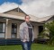 Joel Rudd, director of Phillip Island Holiday Homes, stands outside one of his holiday rentals.