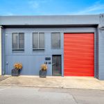 Behind this red roller door lies a jaw-dropping conversion 