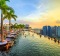 Singapore - May 3, 2018: Infinity Pool at sunset of Skypark that tops the Marina Bay Sands Hotel and Casino from rooftop ...