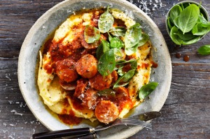 Sausages in sugo with creamy polenta