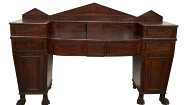 A Regency mahogany "plum pudding" sideboard, circa 1820, sold for $1200.