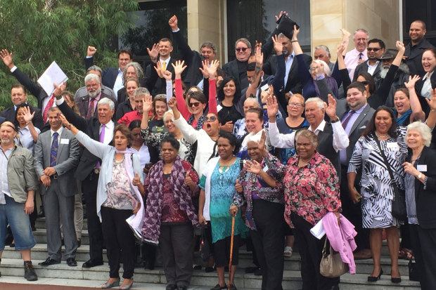 Noongar people and elders celebrating recognition on the steps of WA Parliament.