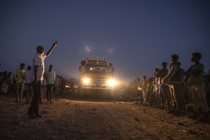 Tigray people who fled the conflict in Ethiopia's Tigray region, arrive on a bus at Umm Rakouba refugee camp in Qadarif, eastern Sudan, Thursday, Nov. 26, 2020